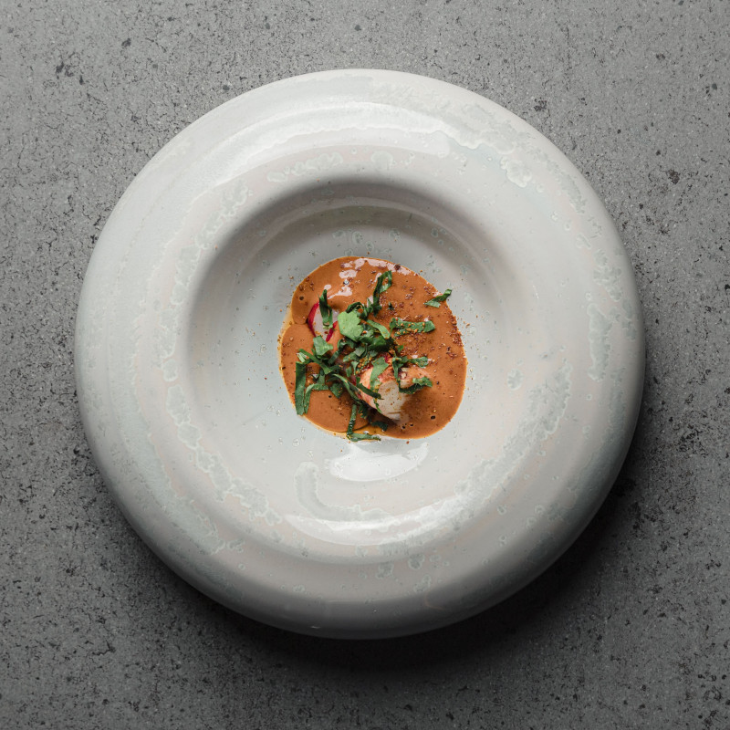 This image shows one of Casamia's signature dishes on a grey stoneware plate