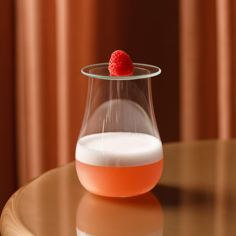 Pictured here is the 'Frothy Boi' raspberry cocktail at Sweeties bar on the 10th floor of The Standard hotel, London
