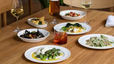 A picture of cocktails, wine and beer at The Italian Greyhound, as well as some pasta and seafood dishes