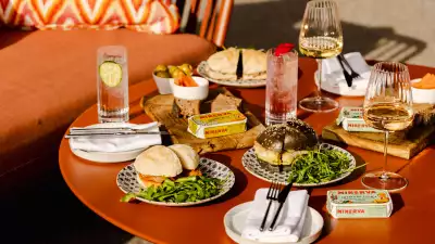 A photo of drinks and dishes at Joia Rooftop