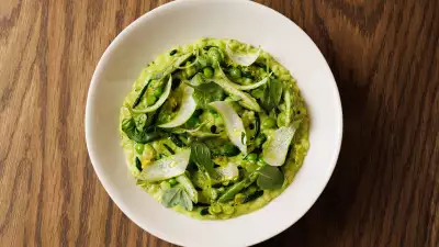 A photo of a green risotto primavera from all'onda