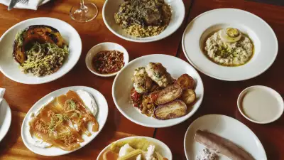 This is an image of a spread of dishes as part of the Slow Sundays menu at Oren