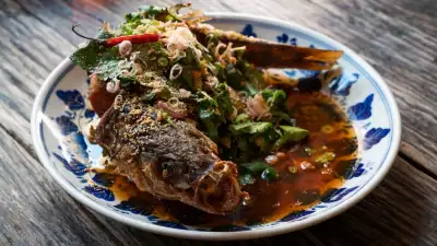 This is a photo of Isaan-style deep fried seabass at som saa
