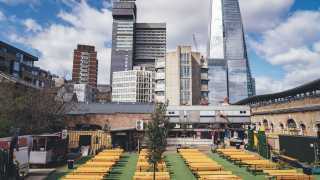 A photo of Vinegar Yard in London Bridge, a large outdoor drinking space with benches