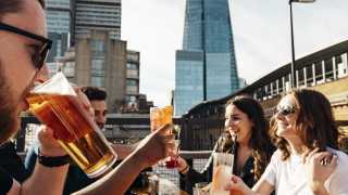 This is a photo of a group of friends drinking beer at the Vinegar Yard, London Bridge, London