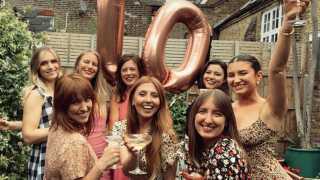 This is a photo of Team Tonic celebrating the company's tenth birthday.