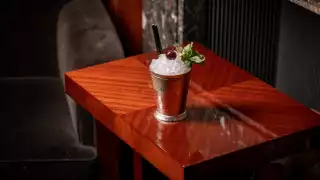 This is an image of the Grinch in the Cup at Le Magritte