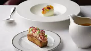 This is an image of a lobster roll at The Colony Grill Room