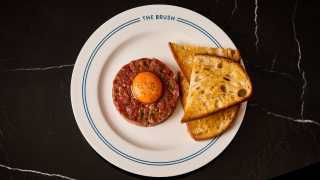 This is an image of steak tartare at The Brush Grand Café