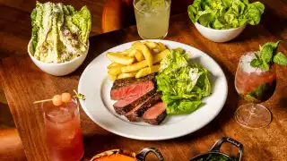 This is an image of a steak along with various sides at Hawksmoor Edinburgh