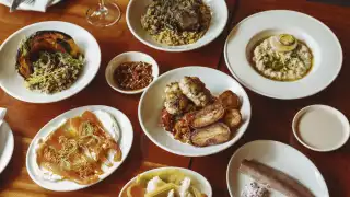 This is an image of a spread of dishes as part of the Slow Sundays menu at Oren