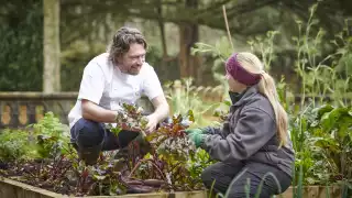 This is an image of chef Shaun Rankin in his kitchen garden at Grantley Hall