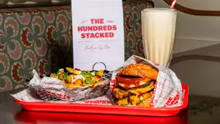 This is an image of a burger, fries and a milkshake from Chet's
