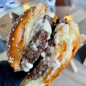 The signature beef and onion burger from Butta, Edinburgh, with two smashed beef patties, crispy fried onions and homemade smoked mayo