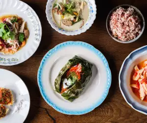 This is an image of a variety of dishes from som saa, a restaurant in London